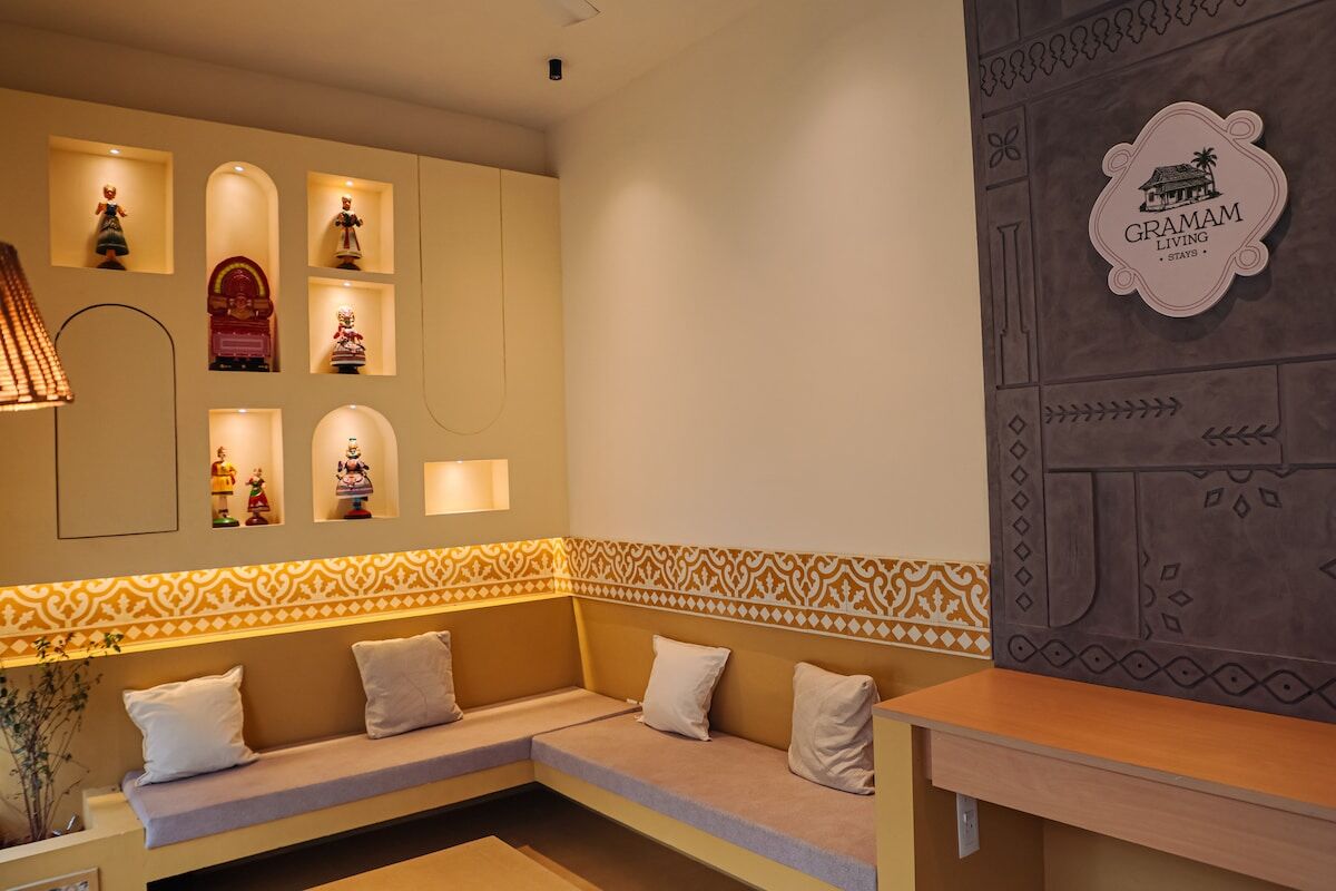 The semi-open lounge at night, its arched niches lit.